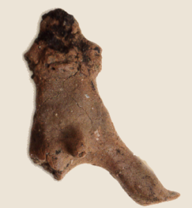 Recovered male clay figurine
