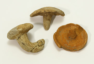Mushroom-shaped baked clay objects 