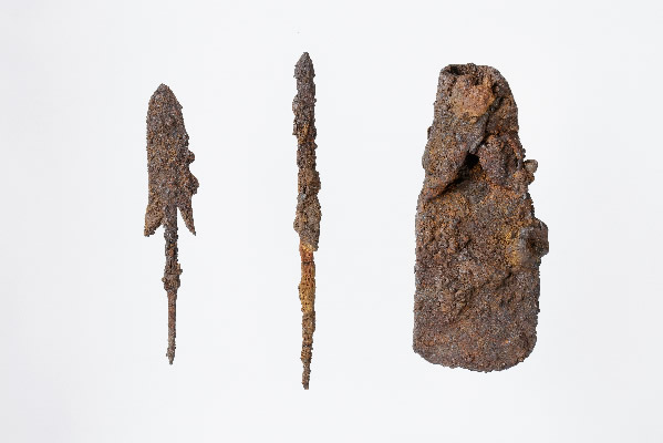 Iron arrowheads (two items at left) and an iron axe
